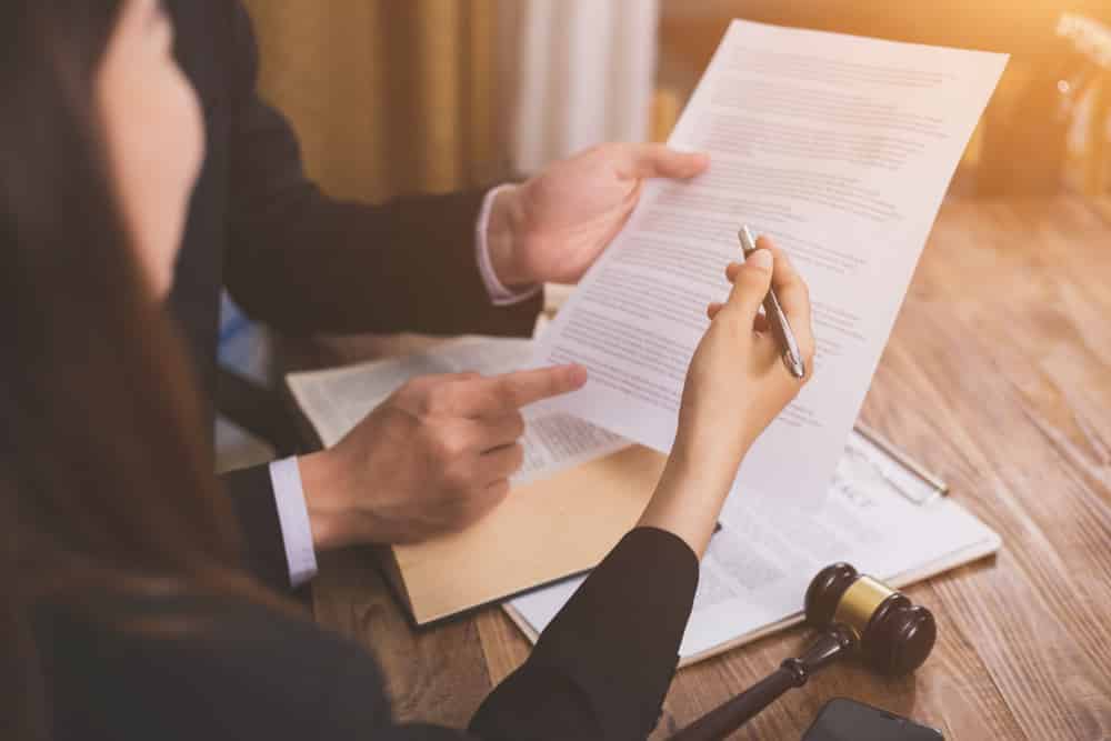 Lawyers with Documents and Pen— Unfair Dismissal Solutions in Australia