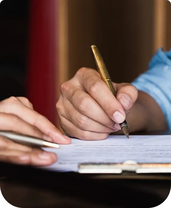 Hands with Pens and Documents — Unfair Dismissal Solutions in Australia