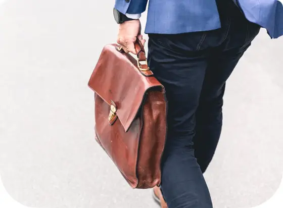 A Man Walking with a Small Suitcase — Unfair Dismissal Solutions in Australia