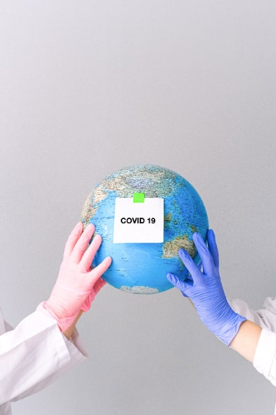 Globe with the Covid 19 Sign on it — Unfair Dismissal Solutions in Australia