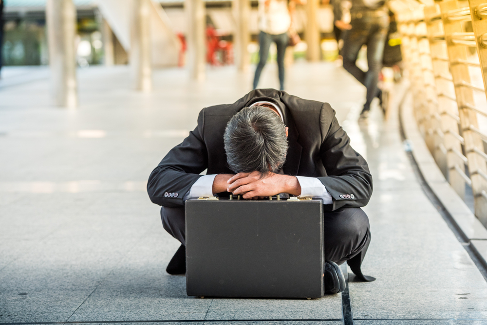 Frustrated Employee Sitting Badly After Losing A Job — Unfair Dismissal Solutions in Australia
