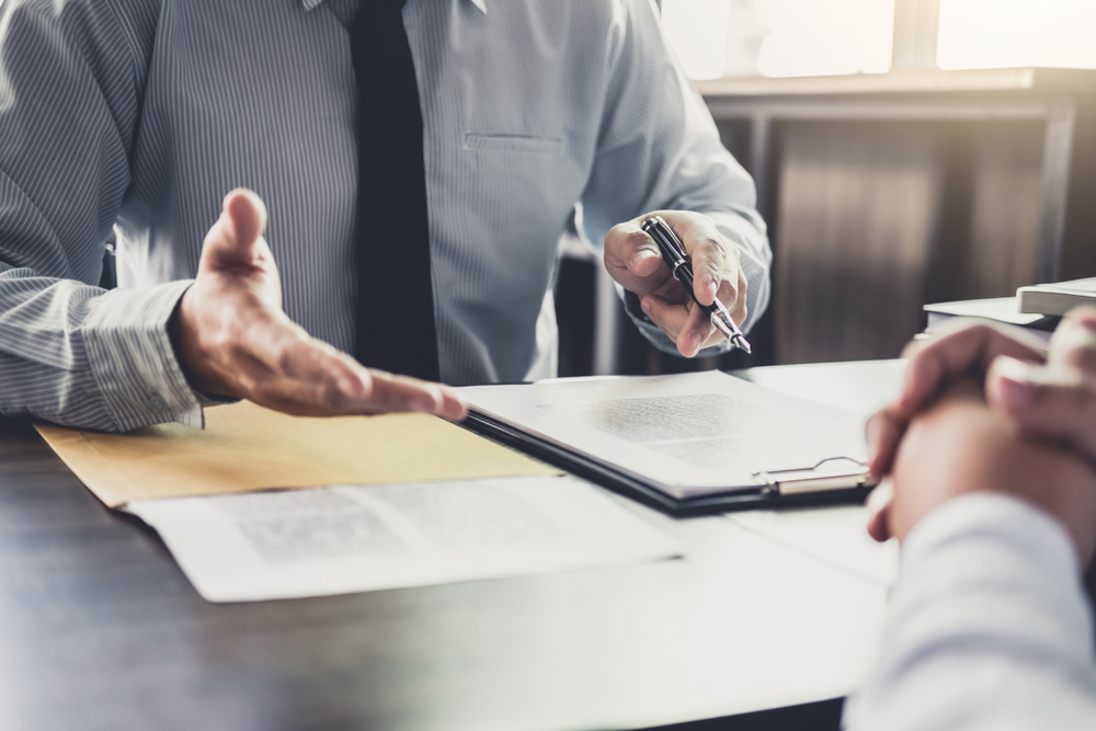 Businessman and Lawyer Discussing Legal Case — Unfair Dismissal Solutions in Australia