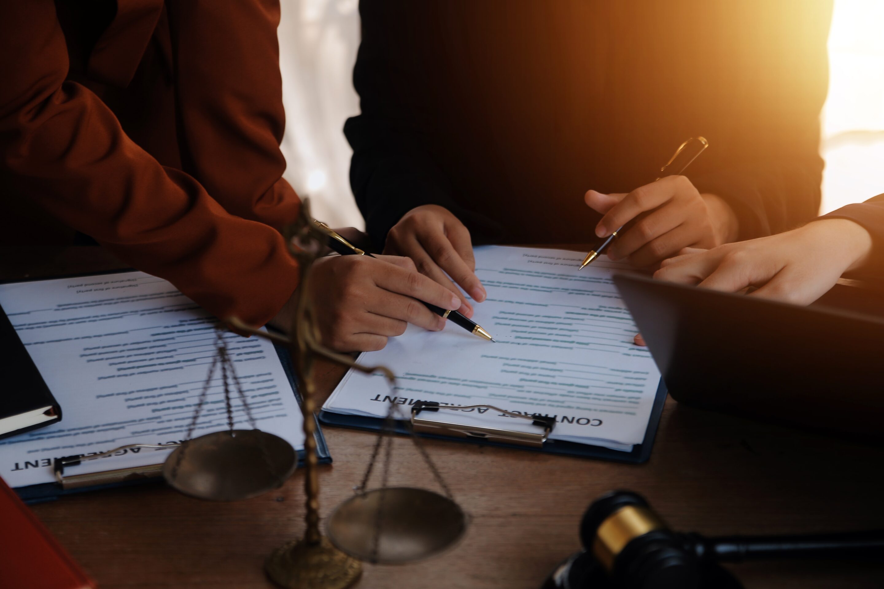 Lawyer Consulting With Lawyers During Mediation Meeting — Unfair Dismissal Solutions in Australia