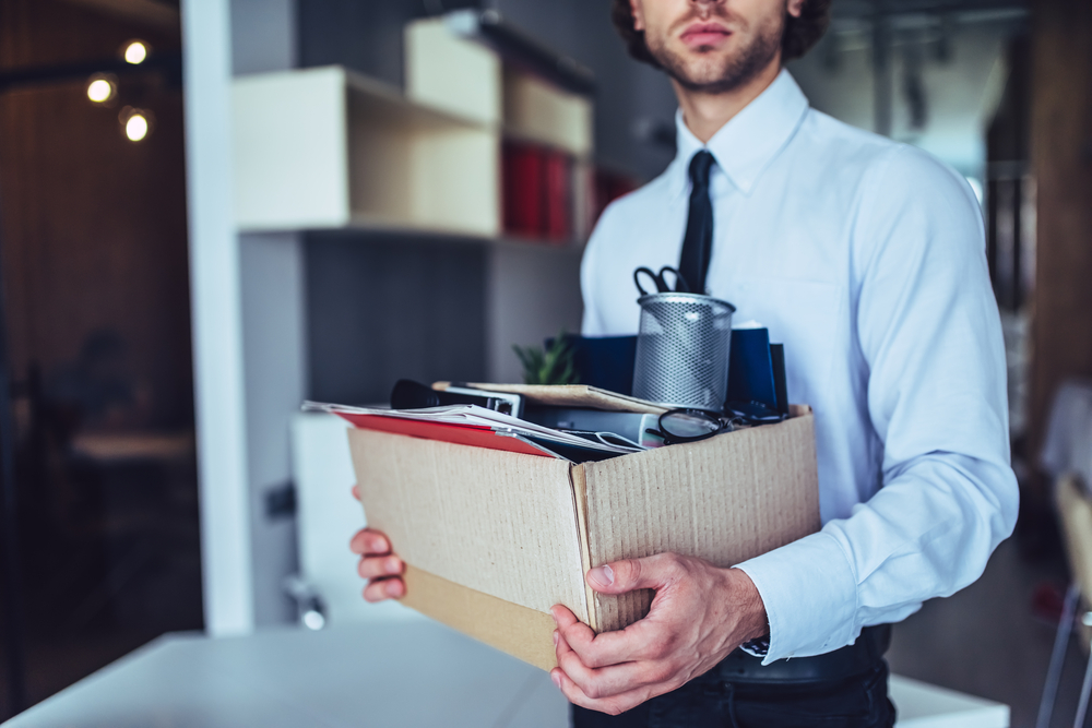 Employee with His Carton Box Exiting Building — Unfair Dismissal Solutions in Australia